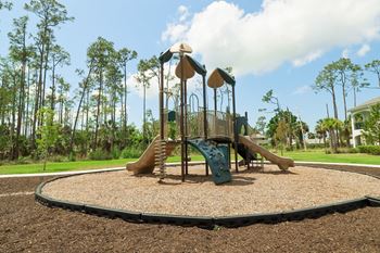 A playground with a slide and monkey bars