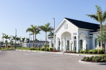A building with a parking lot in front of it