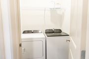 Acworth apartment for rent - the crest at acworth laundry closet with washer and dryer appliances