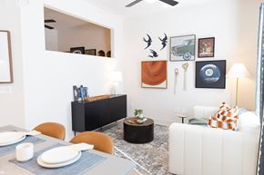 Canton apartment for rent - Table, painting on wall and couch at District on the Etowah Apartments, Canton, 30114