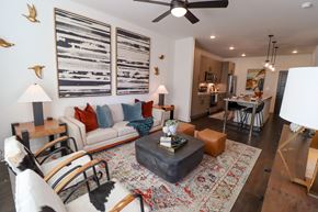 Lawrenceville apartment for rent - The Wren 1 bedroom model apartment home living space with ceiling fan at The Wren Apartments, Lawrenceville , Georgia
