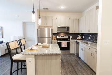 Acworth apartment for rent - A kitchen with a table and chairs in front of it.