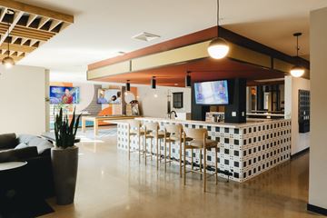 Madison apartment for rent - a lobby with a bar and a living room with a couch