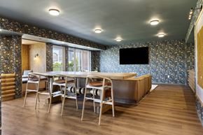 St. Paul apartment for rent - a dining room with a table and chairs and a tv