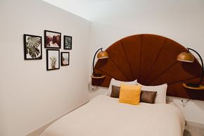 Madison apartment for rent - a bedroom with a bed and a wooden headboard