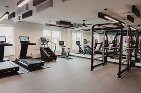Madison apartment for rent - a gym with exercise equipment and windows in a building