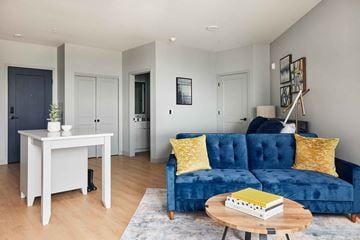 St Paul apartment for rent - a living room with a blue couch and a table