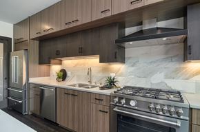Wayzata apartment for rent - a kitchen with stainless steel appliances and wooden cabinets