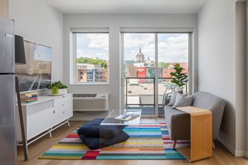 St. Paul apartment for rent - a living room with a view of the city and a couch and a coffee table