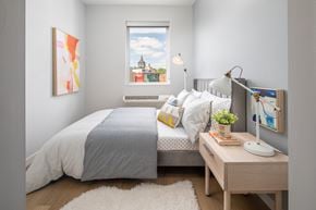 St. Paul apartment for rent - a bedroom with a bed and a window