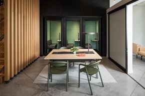 St. Paul apartment for rent - a dining room with a table and chairs in front of a door