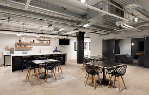 St. Paul apartment for rent - A modern dining area with a white table and black chairs.