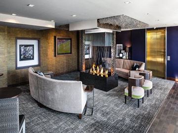 Minneapolis apartment for rent - a living room with a fireplace and couches and chairs