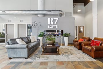 St. Paul apartment for rent - A living room with a grey couch and a brown leather couch.