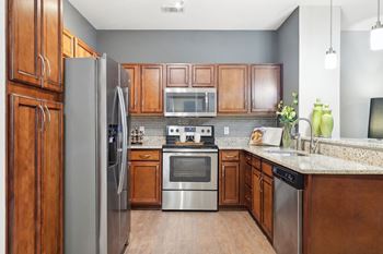 Timeless maple custom cabinetry with nickel finishes*