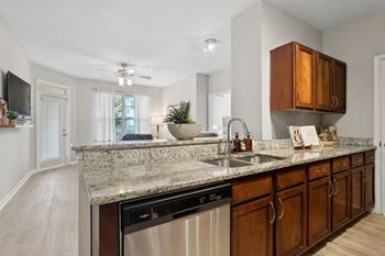Gleaming granite countertops with undermount double sink*