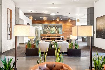 Denver apartment for rent - A modern living room with a couch and a coffee table.