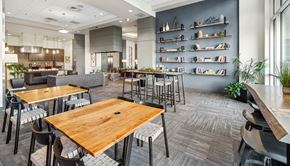 Denver apartment for rent - A modern dining area with wooden tables and chairs.