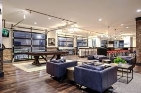 Lawrenceville apartment for rent - a lounge area with couches and tables and a pool table