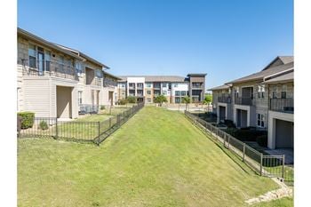 Fenced, private yard  in select apartments