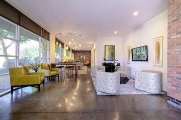 Phoenix apartment for rent - a living room with couches and chairs and a dining room
