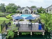 Dublin apartment for rent - A pool area with a deck and umbrellas.