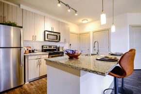 Lawrenceville apartment for rent - a photo of a glass table with a reflection of a building on it