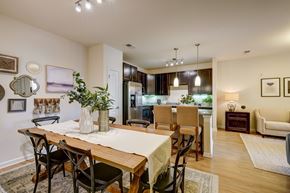 Charlotte apartment for rent - A dining room with a wooden table and chairs.