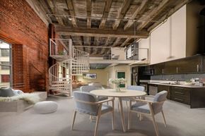 Los Angeles apartment for rent - A dining room with a round table and grey chairs.
