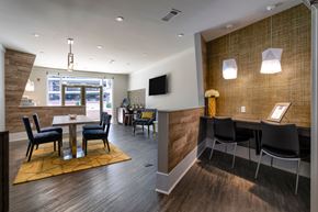 Nashville apartment for rent - A modern dining room with a wooden table and chairs.