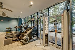Nashville apartment for rent - A gym with treadmills, elliptical machines and a fan.