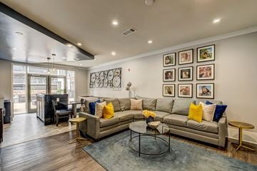 Nashville apartment for rent - A living room with a grey couch and a coffee table.