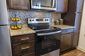 Nashville apartment for rent - A modern kitchen with a stainless steel oven and microwave.