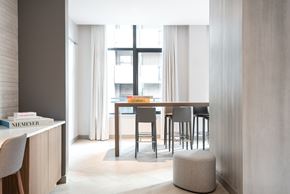 Washington apartment for rent - A modern dining room with a wooden table and chairs.