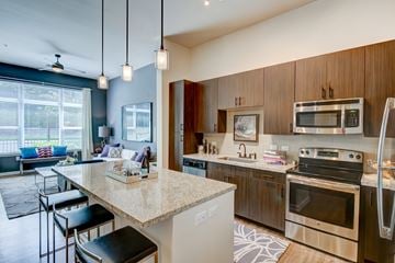Durham apartment for rent - A kitchen with a bar area and a dining area.
