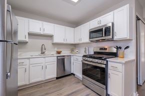 Columbus apartment for rent - Heathermoor and Bedford Commons apartments kitchen with white cabinets and stainless appliances