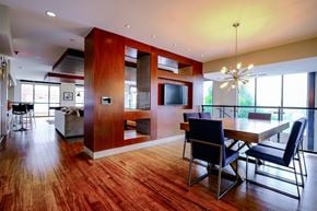 Durham apartment for rent - A modern dining room with a wooden table and chairs.