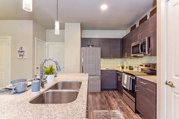 Kitchens with granite countertops and islands