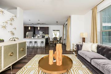 Dallas apartment for rent - a living room with a couch and a table