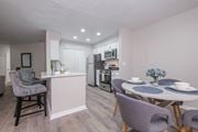 Gahanna apartment for rent - A kitchen with a dining table and chairs.