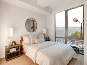 Washington apartment for rent - RiverPoint apartments in Washington, DC bedroom with floor to ceiling windows and sweeping waterfront views