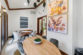 Dallas apartment for rent - A dining room with a wooden table and chairs.