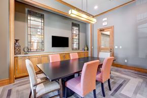 Austin apartment for rent - A modern dining room with a dark table and chairs.