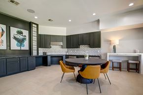 Humble apartment for rent - A modern kitchen with a dining table and chairs.