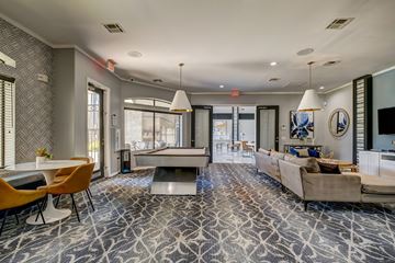 Humble apartment for rent - A living room with a pool table and a couch.