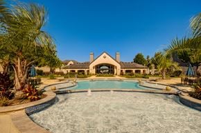 Humble apartment for rent - A large house with a pool in the front yard.