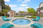 Fairfield apartment for rent - A pool with a fountain in the middle of it.