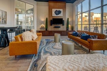 Mckinney apartment for rent - A living room with a yellow couch and a white sofa.