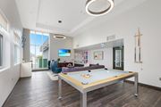 Walnut Creek apartment for rent - A pool table in a room with a TV and a chair.