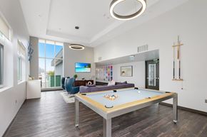 Walnut Creek apartment for rent - A pool table in a room with a TV and a chair.